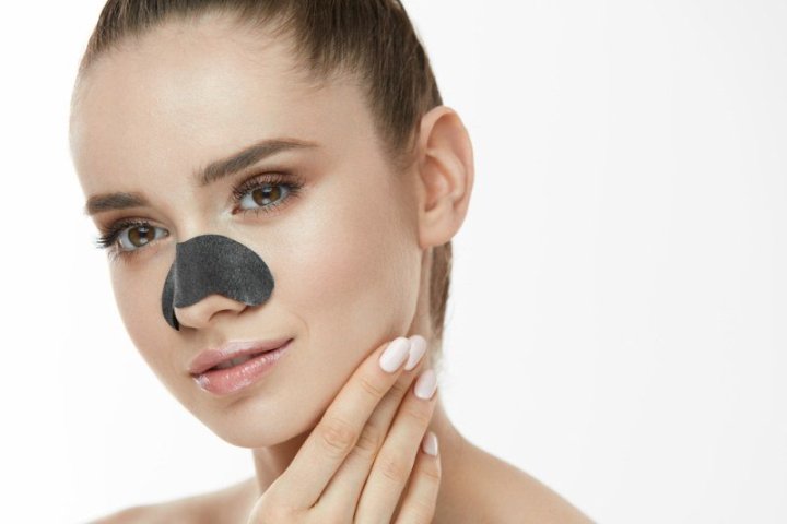 Skin-Cleaning.-Closeup-Of-Beautiful-Young-Woman-With-Black-Textile-Mask-On-Nose.
